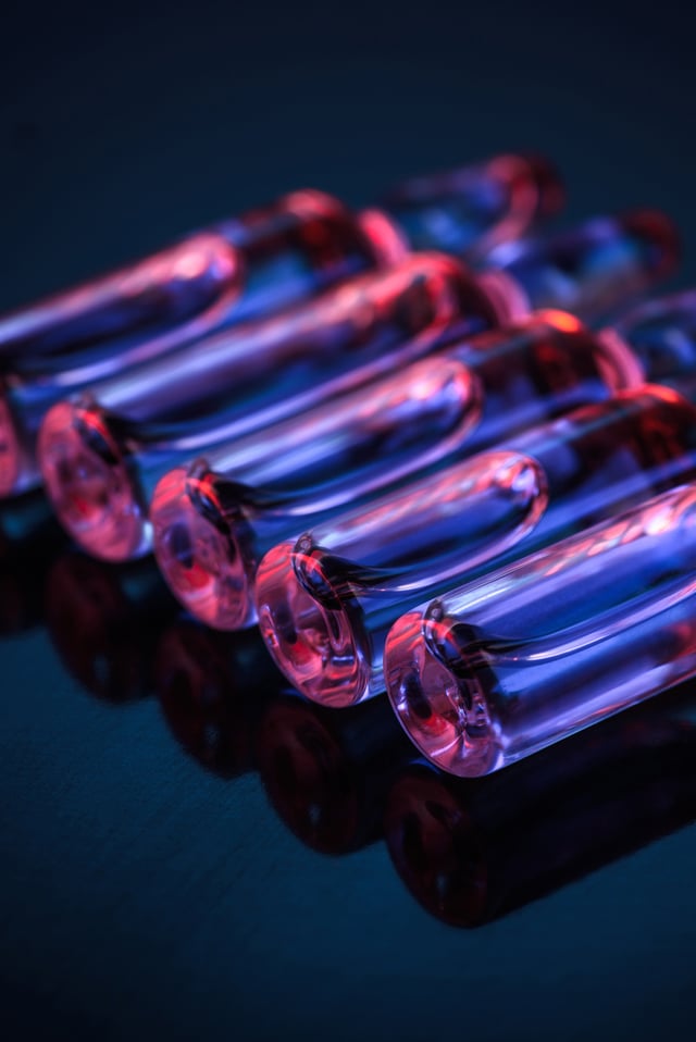 Section - close-up-of-row-of-transparent-glass-ampoules-with-2024-11-19-04-56-55-utc